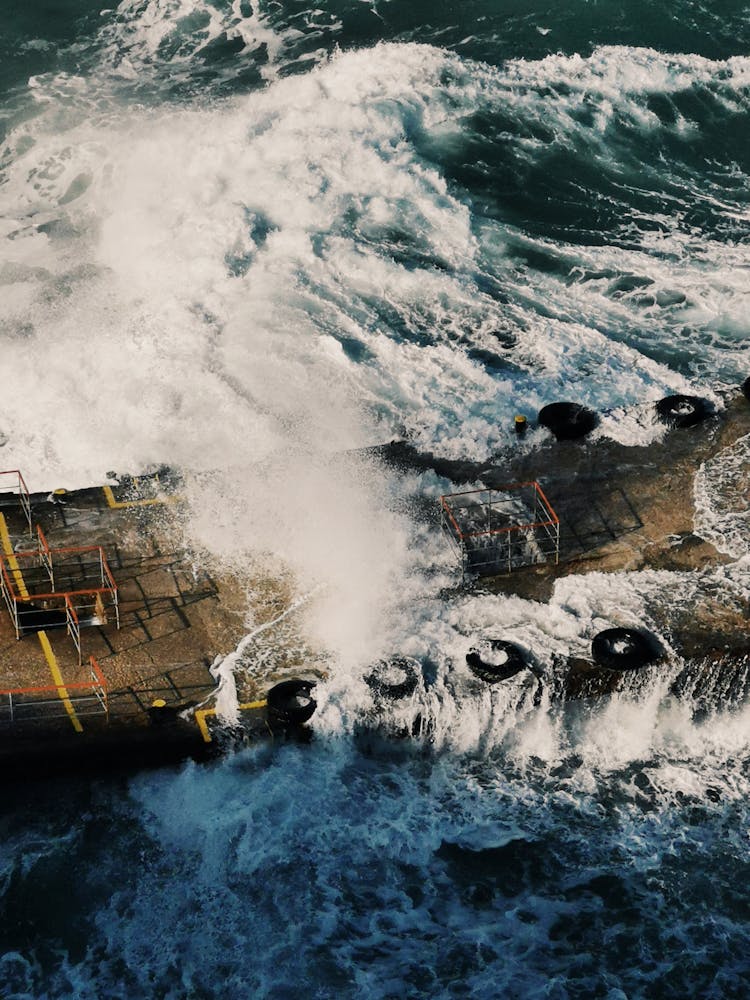 Waves Over Pier On Sea Shore