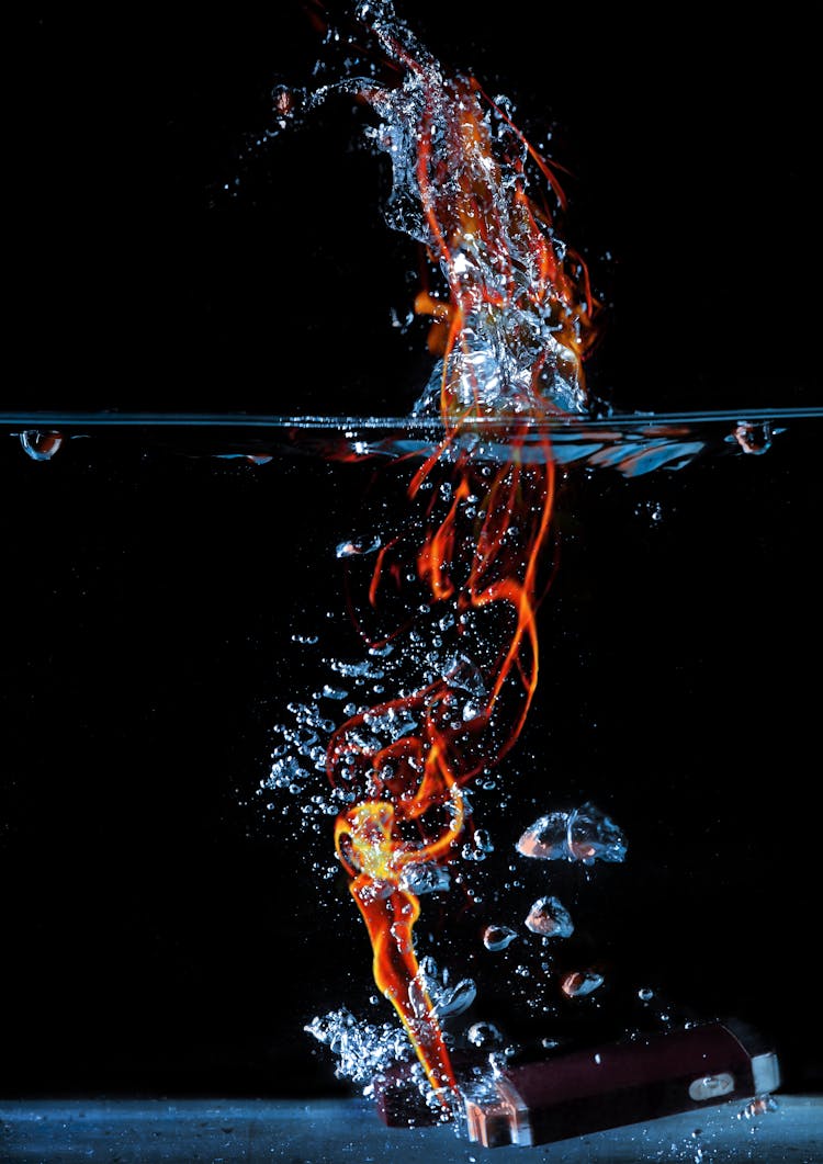 A Lighted With Fire Dropped On A Water