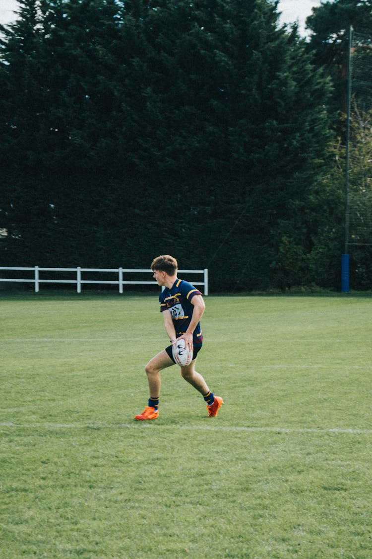 Boy Running With The Ball 