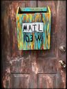 Multi-coloured Wooden Mailbox Mounted On Door