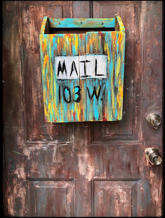 Multi-coloured Wooden Mailbox Mounted On Door