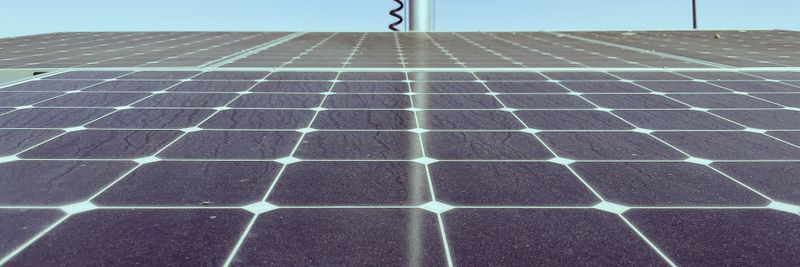 Detailed view of solar panels capturing sunlight, showcasing renewable energy technology.