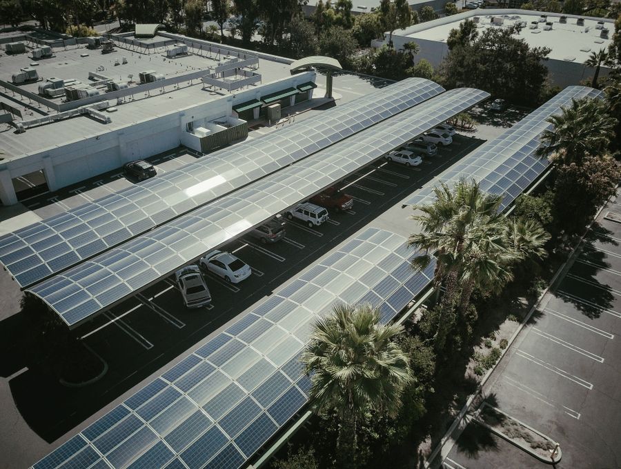 Installer fitting solar panels on a rooftop