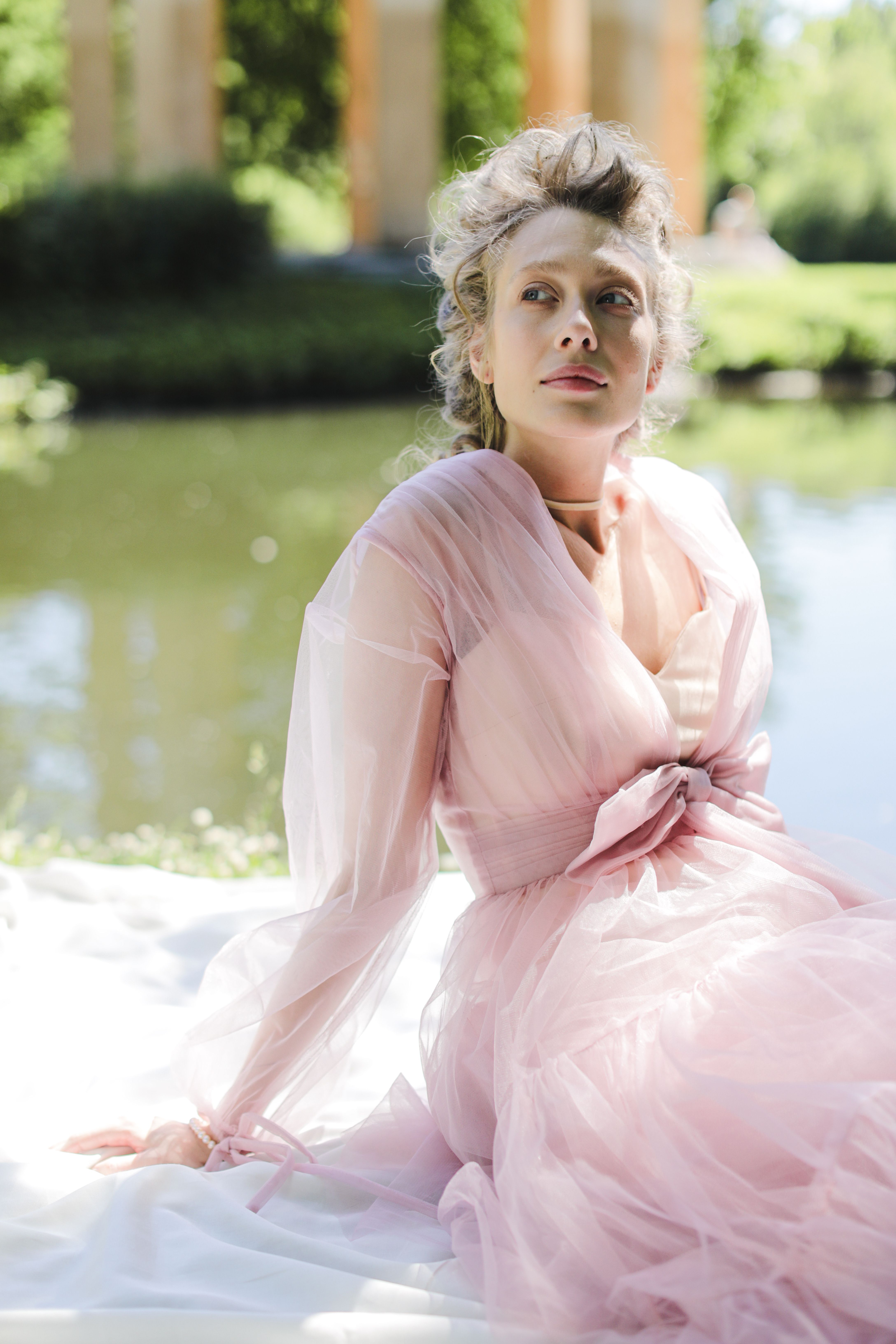 Beautiful Woman in Pink Dress Posing by Pond · Free Stock Photo