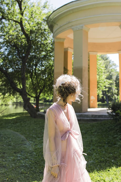 Elegant Woman in Pink Sheer Dress 