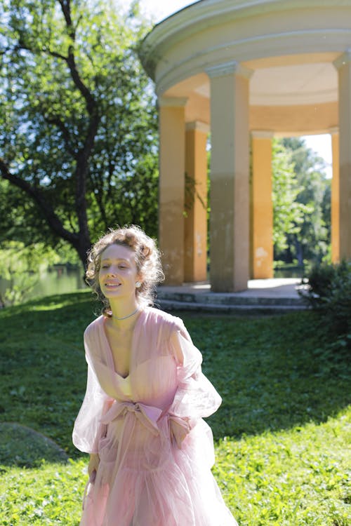 Happy Elegant Woman in Pink Sheer Dress