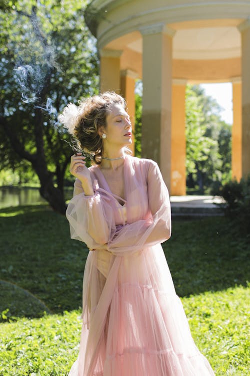 Elegant Woman in Pink Sheer Dress