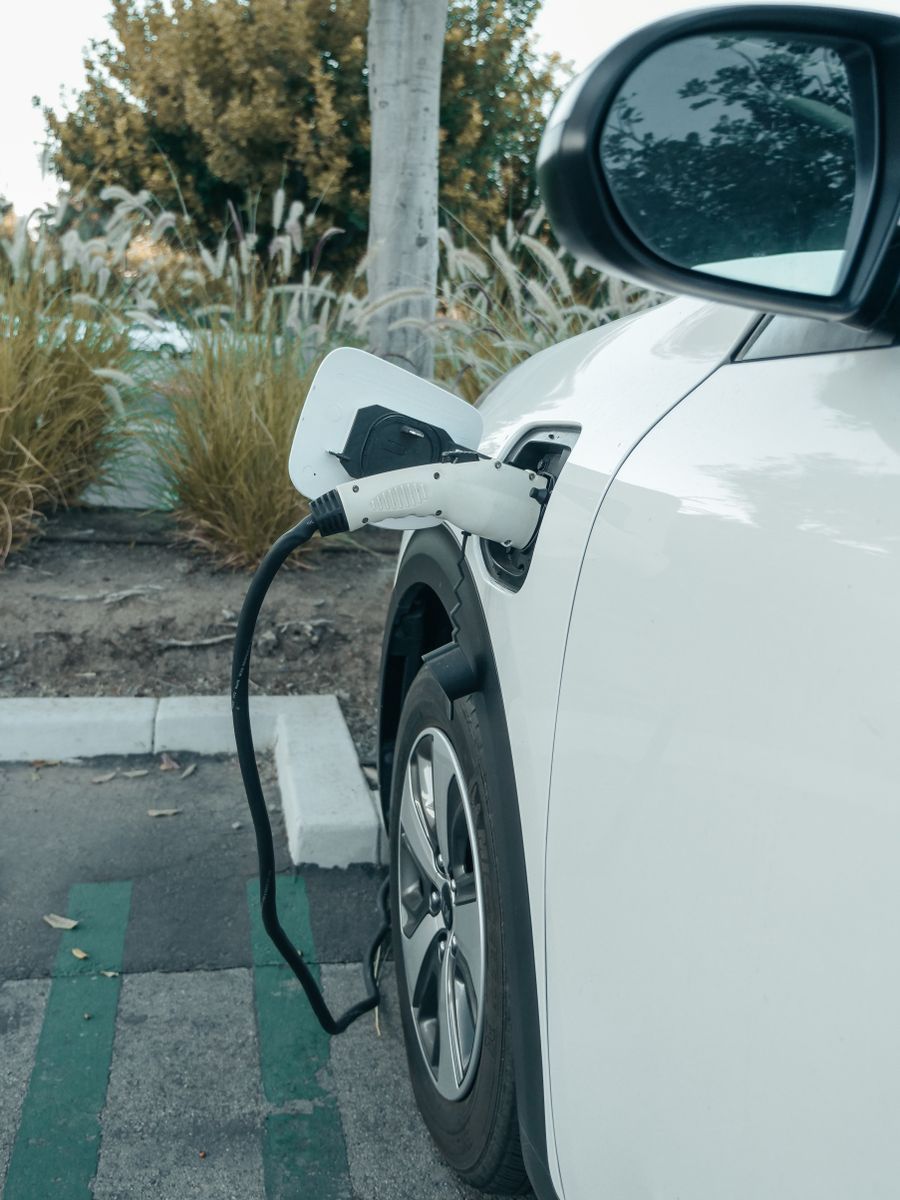 EV charging network comparison US 2026 — multiple charging stations at highway stop