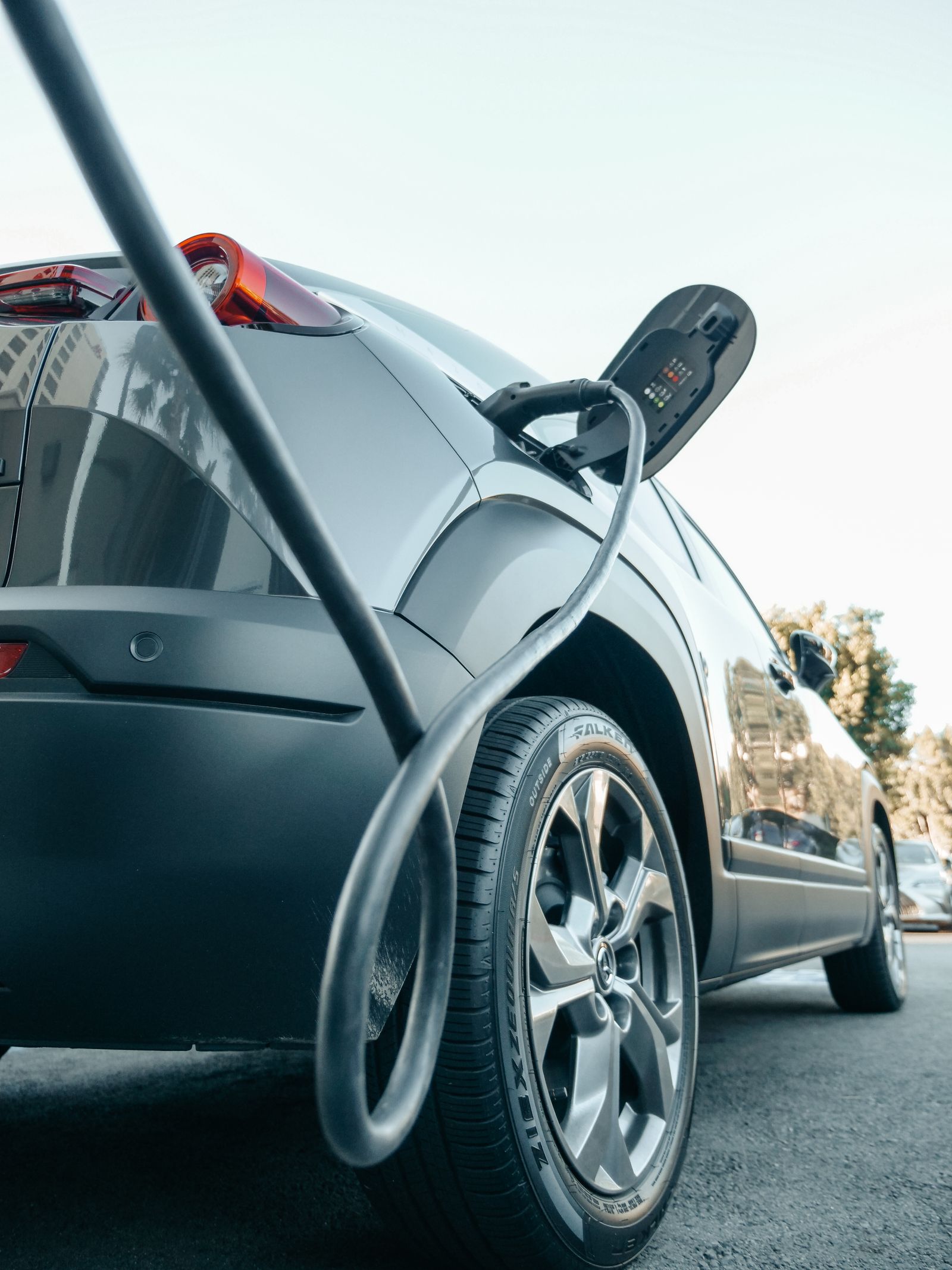 Electric car charging at a wall-mounted charge point