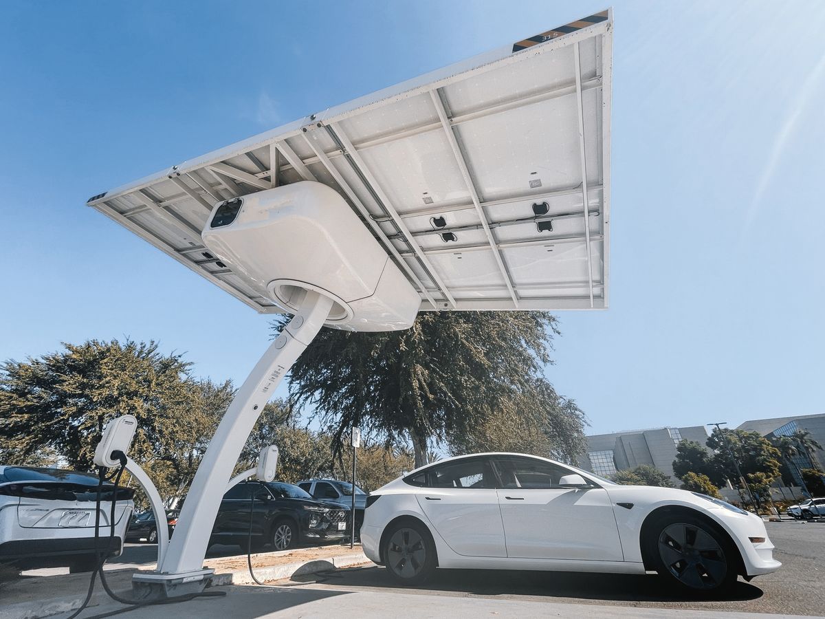 Electric vehicle charging at a solar-powered station