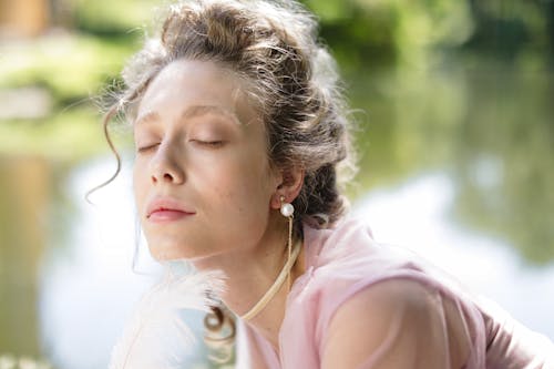 Woman Wearing Pearl Earrings