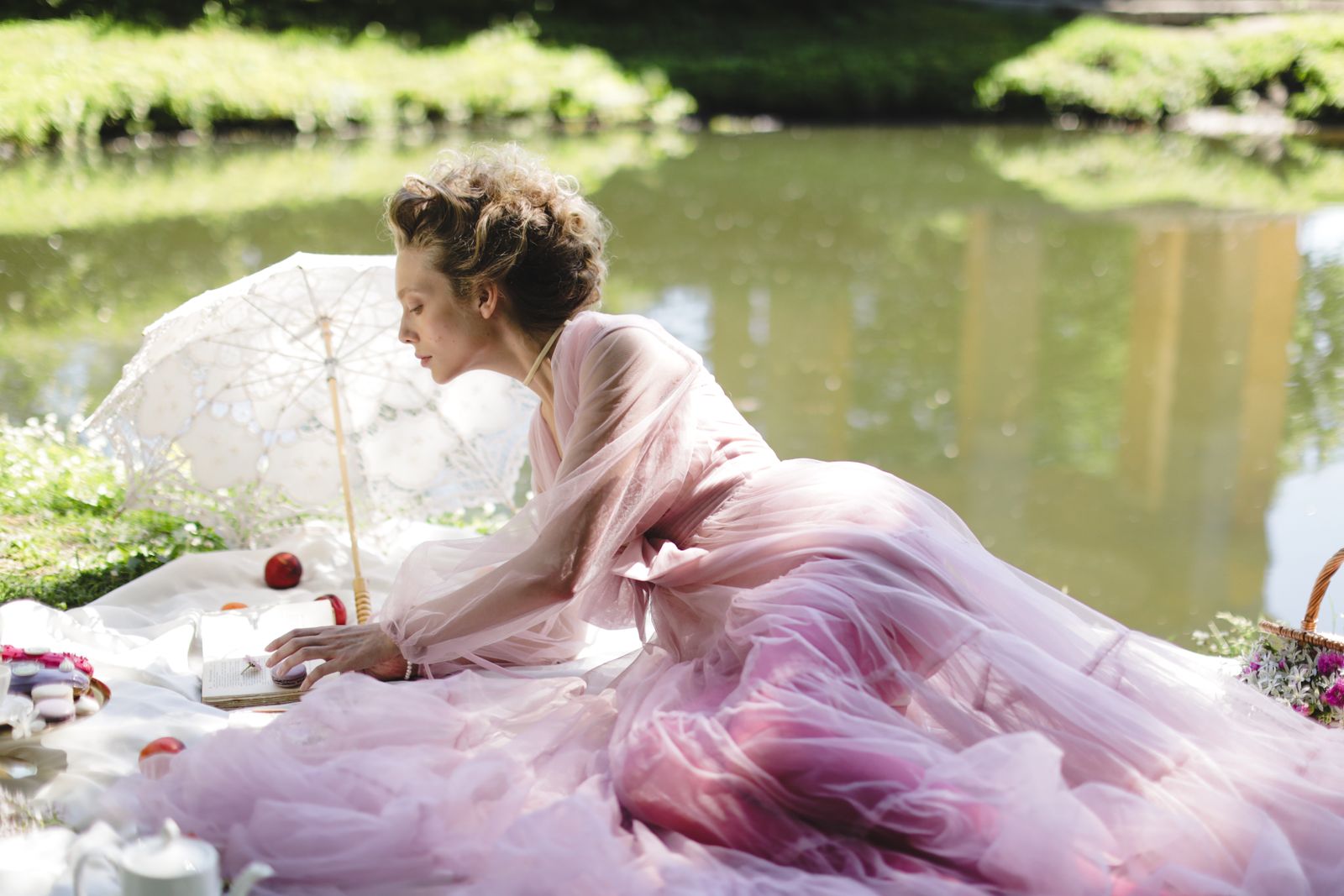 An elegant woman in a pink sheer dress — the ESVRA Blush Edit of wedding guest dressing in pink