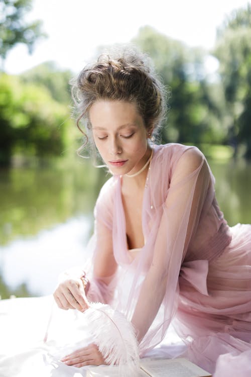 Elegant Woman in Pink Sheer Dress