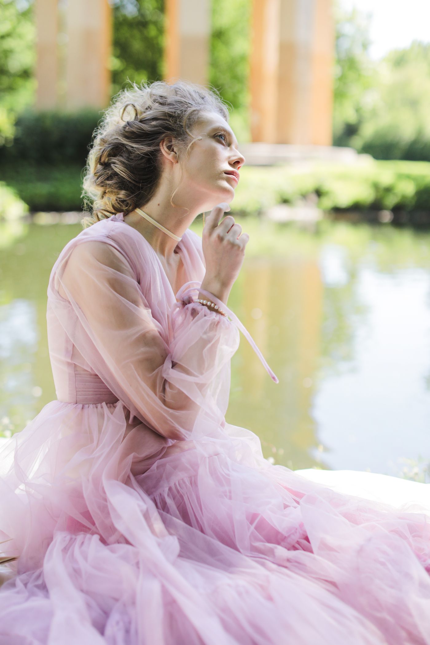 A woman in an elegant pink gown — the closing image of the ESVRA Blush Edit