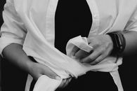 Woman tying her shirt into knot