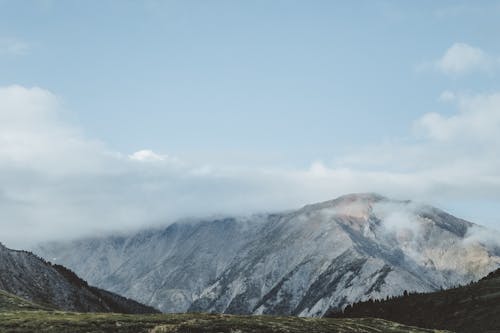 Mountain Range against a Cloudy Sky 