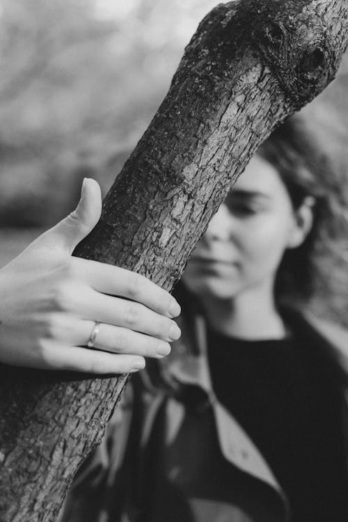 Woman Holding Tree Branch