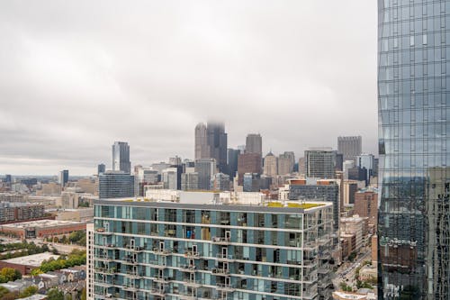 City Buildings Under Cloudy Sky