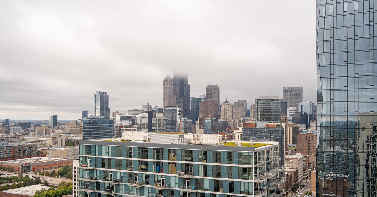 A cloudy view of the Chicago skyline featuring high-rise buildings including the iconic Willis Tower.