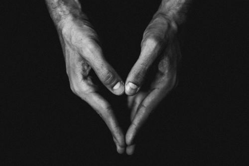 Free Black and white image of hands forming a heart shape, conveying love and care. Stock Photo