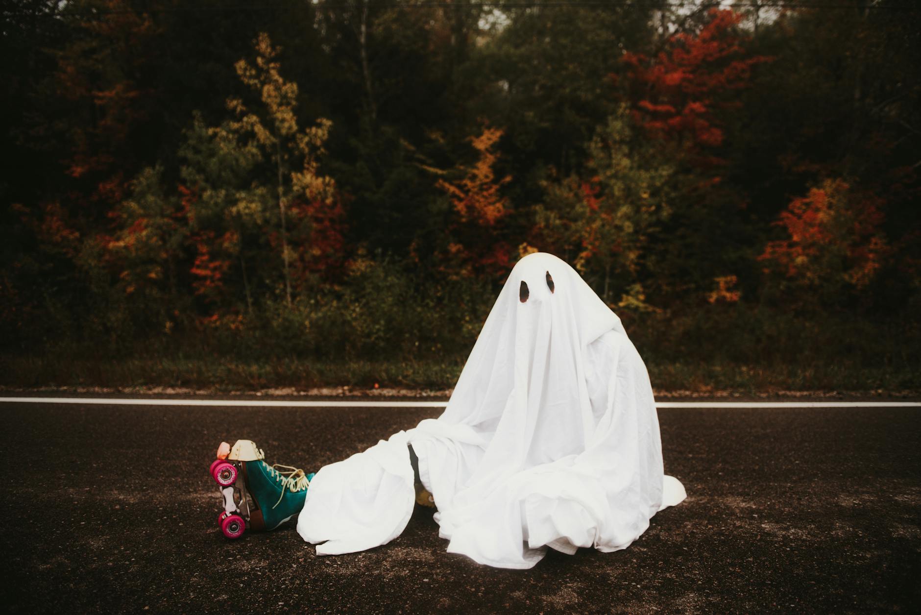 https://www.pexels.com/photo/person-in-ghost-costume-sitting-on-road-9802279/