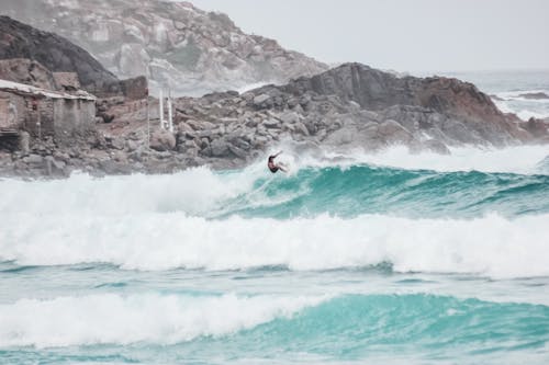 Man Surfing on Sea Waves