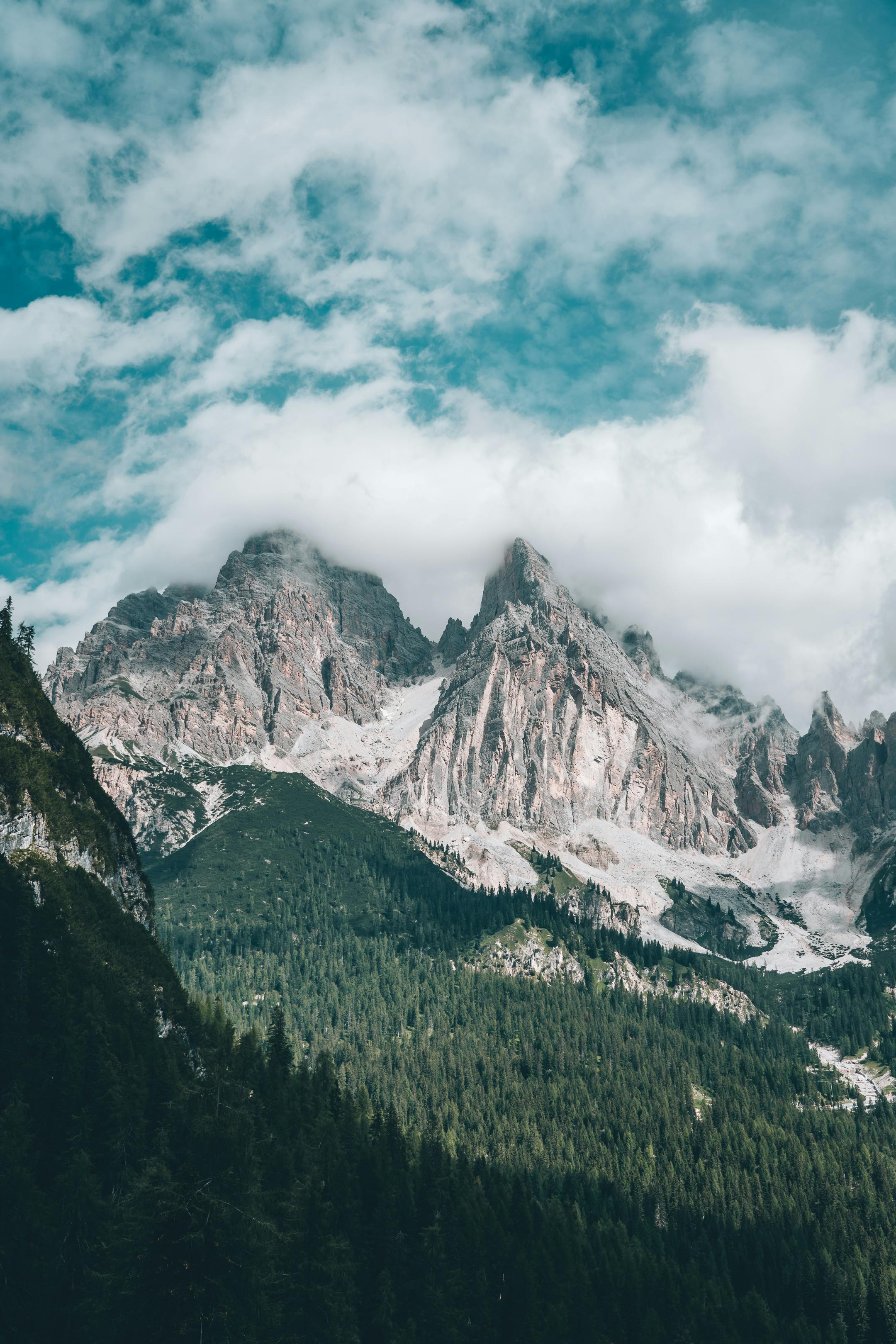 Body of Water in a Valley Surrounded by Mountains · Free Stock Photo