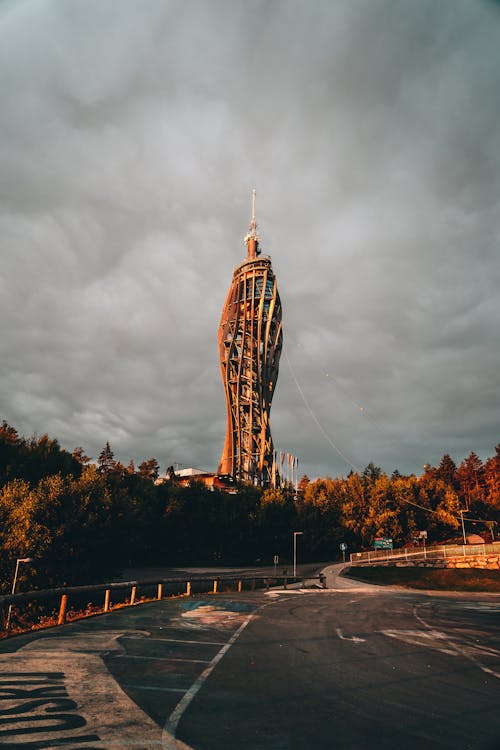 Photo of a Tower against a Cloudy Sky 