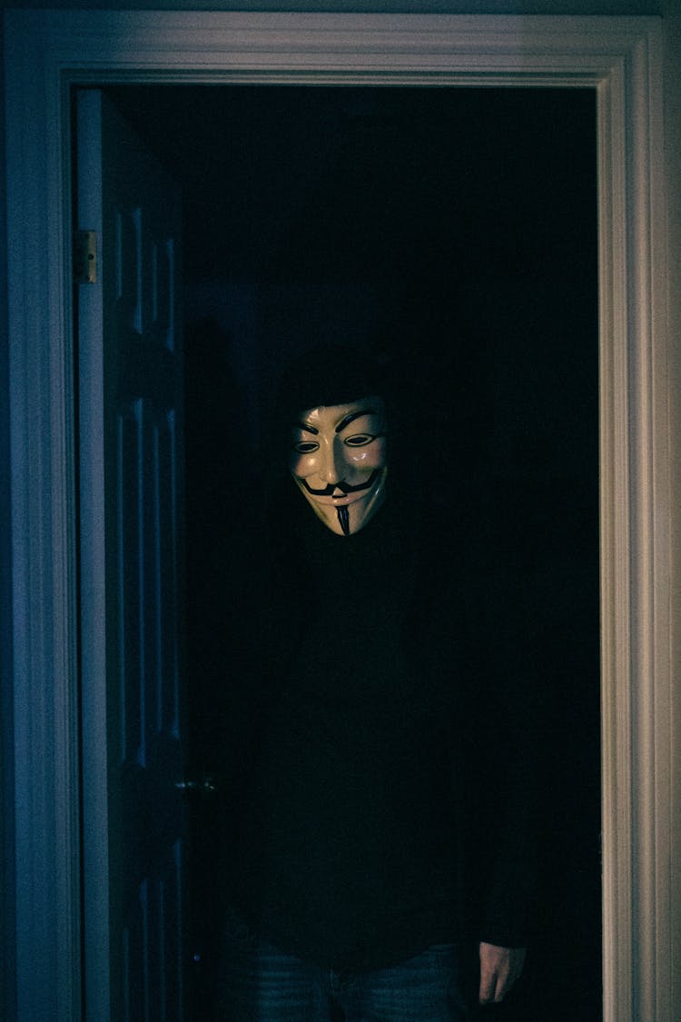 Person In Black Long Sleeve Shirt Wearing A Mask