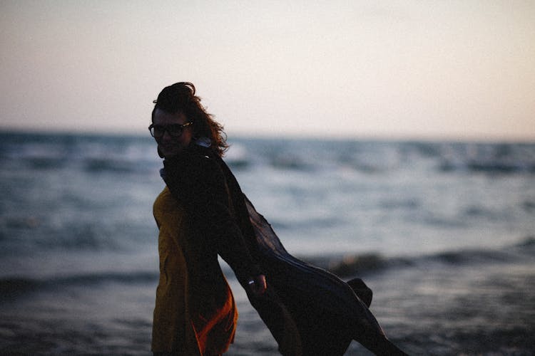 Silhouette Of A Woman With A Cape