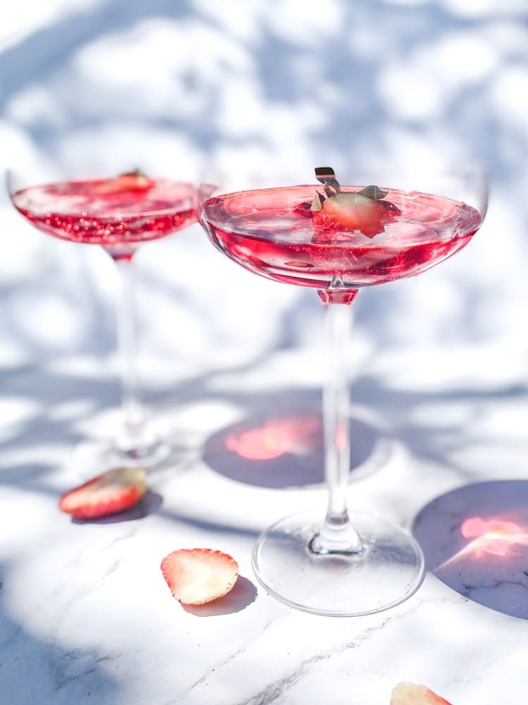 Close-up Of Cocktail Glasses Reflecting Light