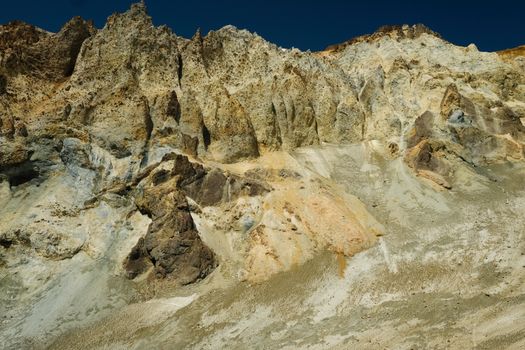 A stunning rock formation under a clear blue sky, showcasing nature's artistry.