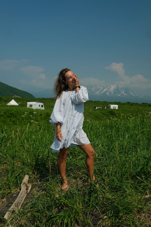 Woman in White Dress Standing in the Field