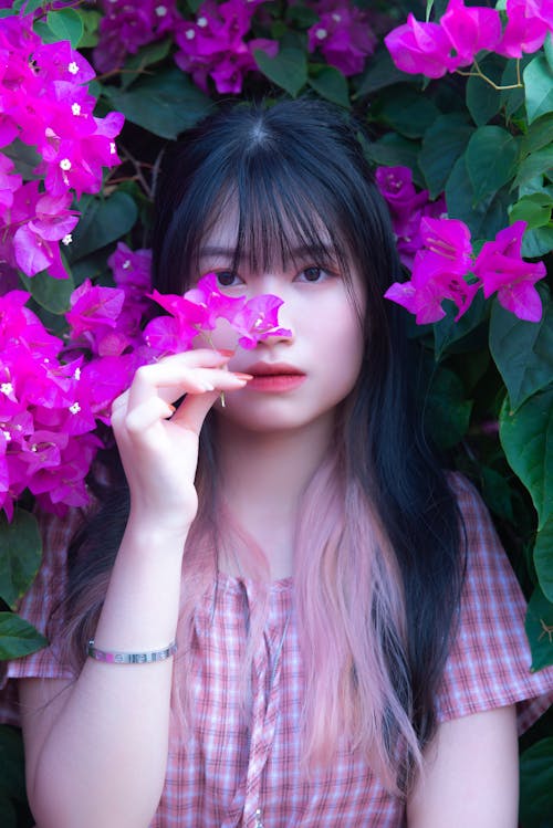 Beautiful Woman Holding Purple Flower