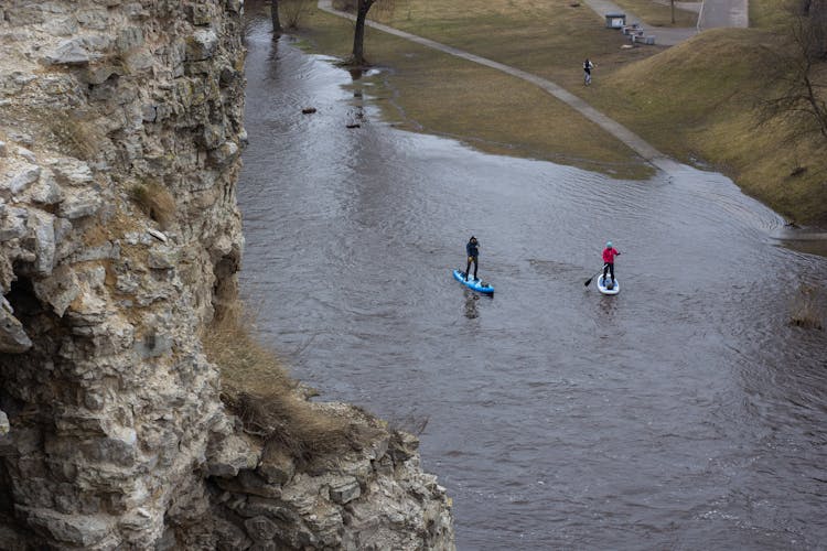 Drone Shot Of Men Paddleboarding