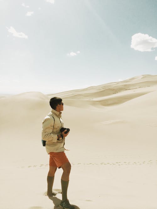 Man Standing on Desert