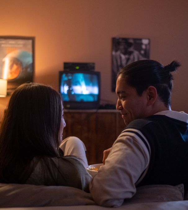 Couple watching television on the couch