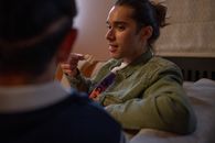 Man eating snacks and talking