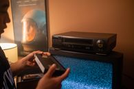 Person holding a videotape