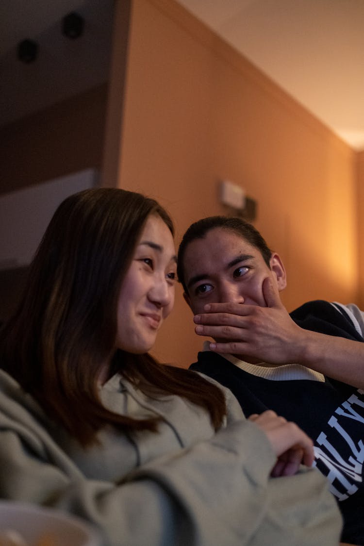 Man And Woman Chatting White Watching Movie