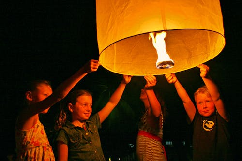 Children Holding a Lantern in the Dark