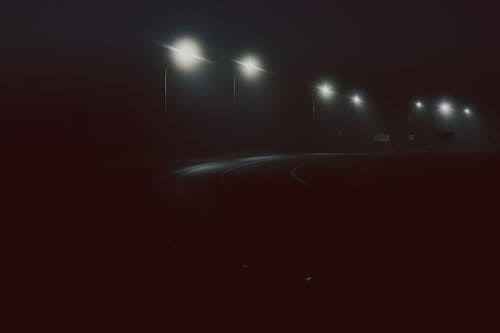 Free Photograph of Street Lights Near a Road During Nighttime Stock Photo