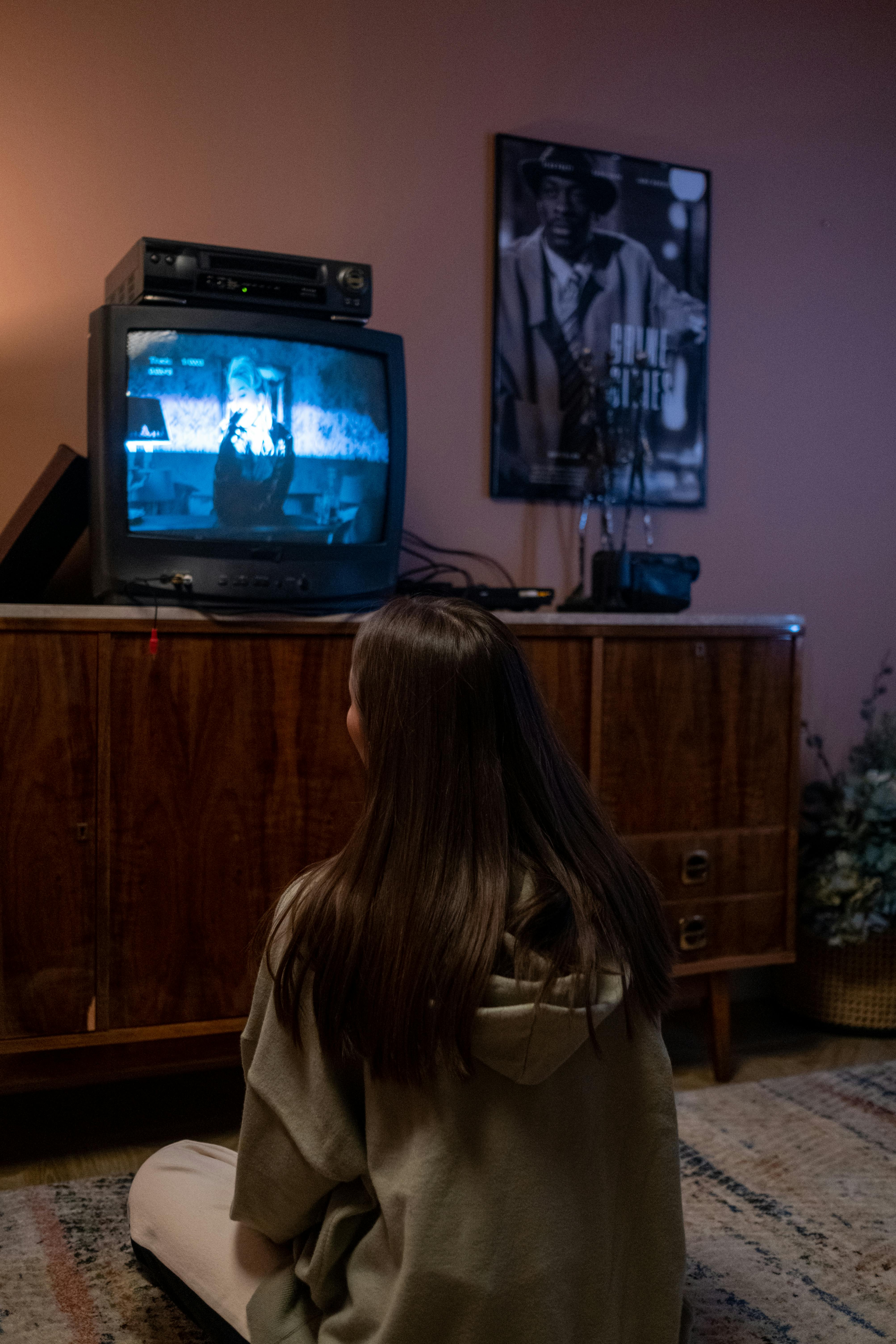 young girl watching tv