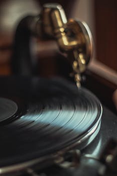 Close-up shot of a classic gramophone playing a vinyl record, capturing a nostalgic vibe.