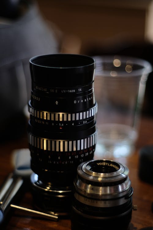 Free Black Camera Lens on Table Stock Photo
