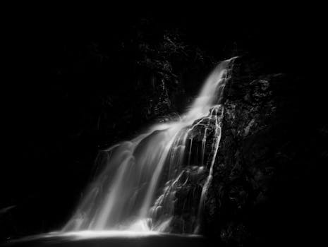 A stunning long exposure monochrome image of a waterfall in Okinawa, capturing its natural beauty.