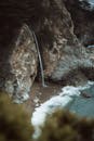 Photo of small waterfall on beach