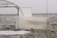 White Wooden Sheets on Brown Grass