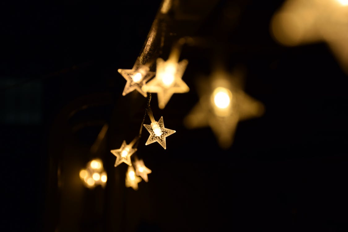 Free Shallow Focus Photography of Yellow Star Lanterns Stock Photo