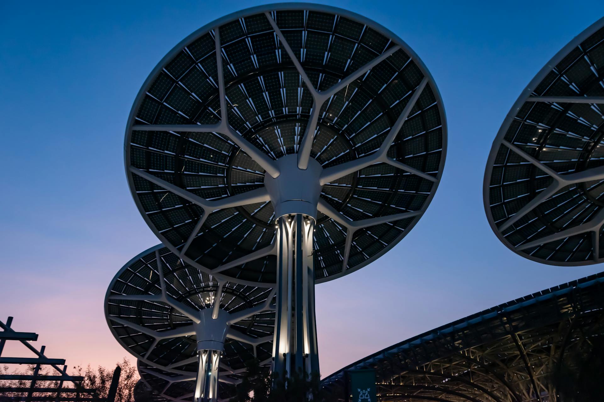 Illuminated solar trees at Dubai Expo 2020, showcasing sustainable energy technology.